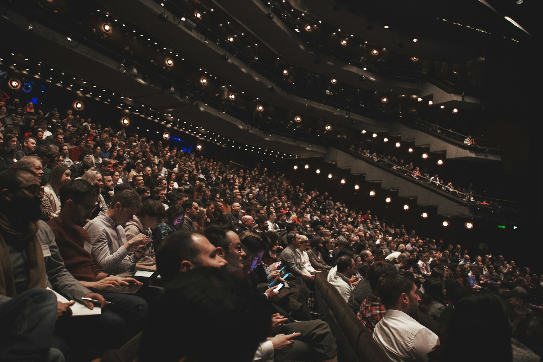 An audience seated in an auditorium at the Barbican Centre in London. Editorial exchange image, not a Raphael Gielgen event.