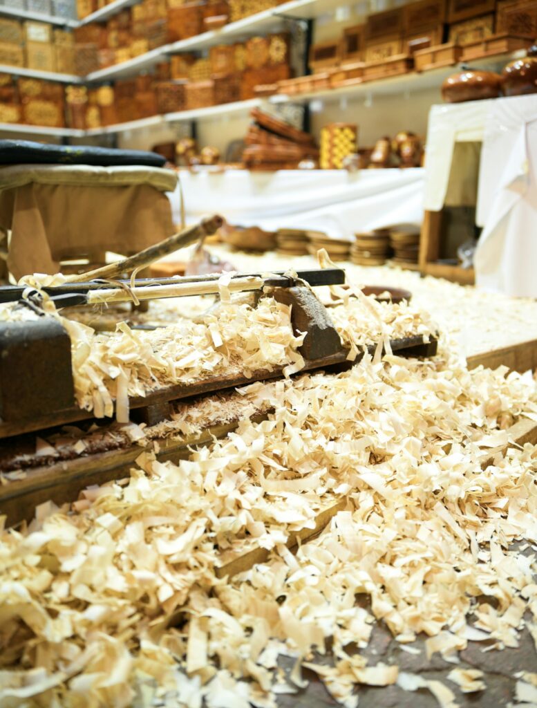 A wooden hand plane among shavings in a carpenter’s workshop in Marrakesh.